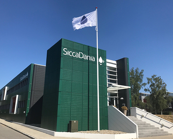 SiccaDania headquarters building with flag